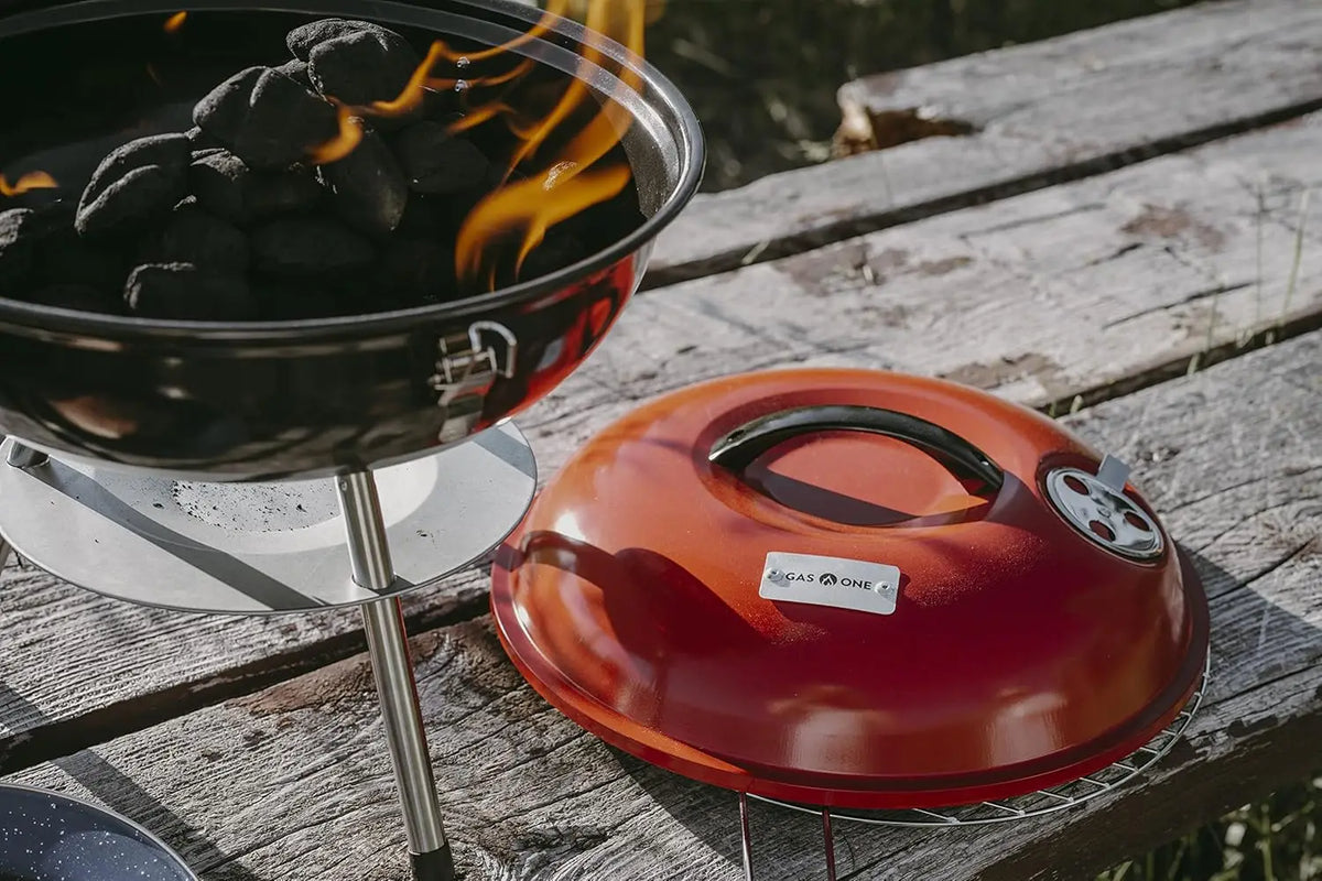 Portable Charcoal Grill With Dual Venting And Locking Lid Design