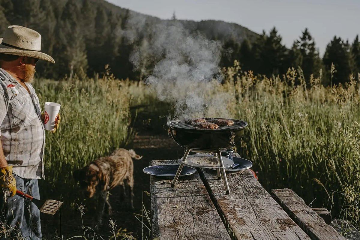 Portable Charcoal Grill With Dual Venting And Locking Lid Design